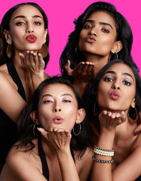 Diverse women showcasing radiant looks with "Light Up Lipstick" product.