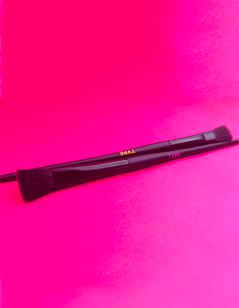 Makeup brushes on a vibrant pink background for "BRUSH UP ON SCIENCE."