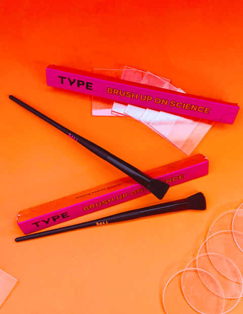 Brush Up on Science makeup brushes with packaging and tools.