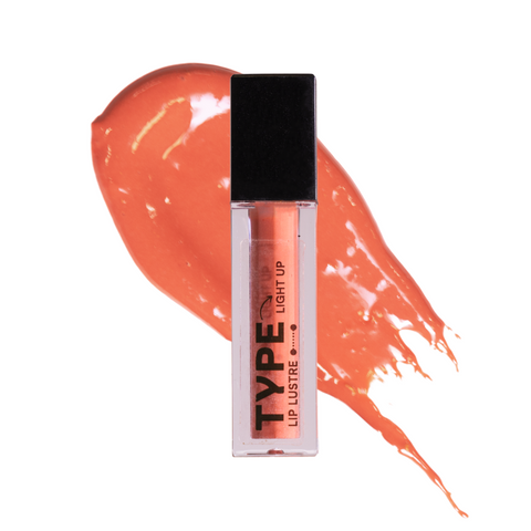 "LIGHT UP LIP LUSTRE MINI in vibrant coral shade with glossy finish."