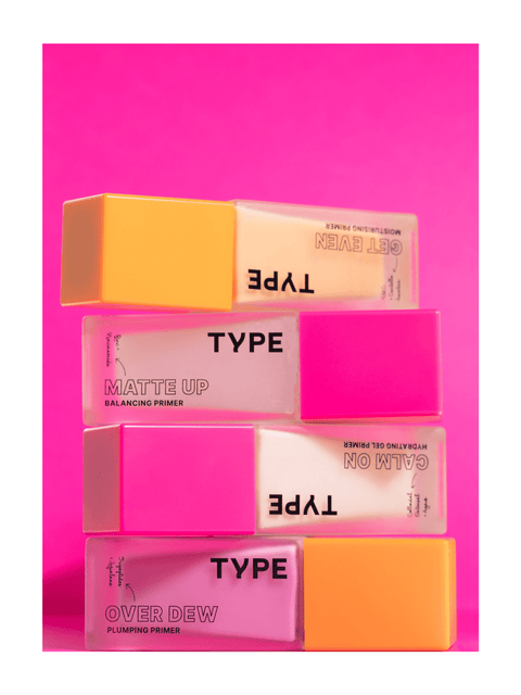 "Colorful primer sample set stacked against a vibrant pink background."