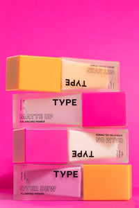 MATTE UP Balancing Primer with vibrant packaging on pink background.