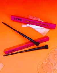 Brush Up on Science makeup brushes with packaging and tools.