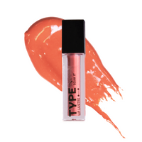 "SOAK IT LIP LUSTRE MINI with coral gloss swirl background"
